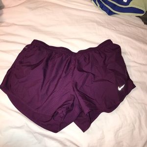 Purple Nike running shorts